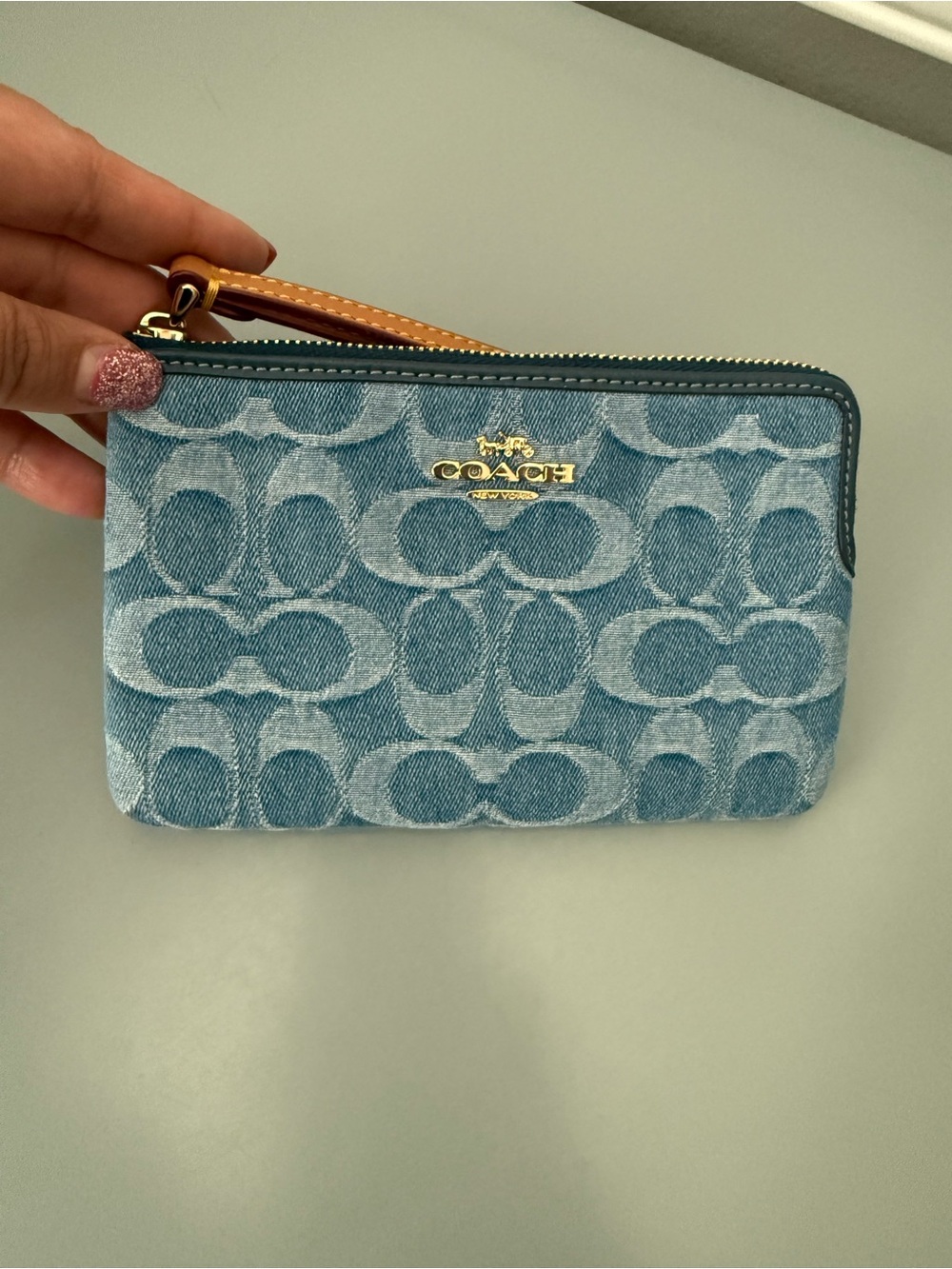 COACH OUTLET Denim wristlet.